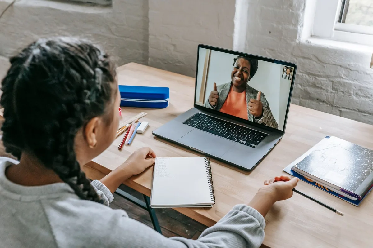 A student in an online class on a laptop at home