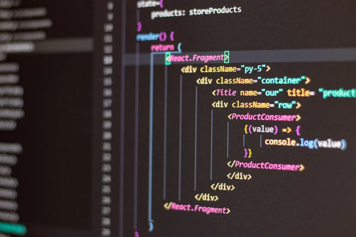 A developer configuring a learning platform across two monitors
