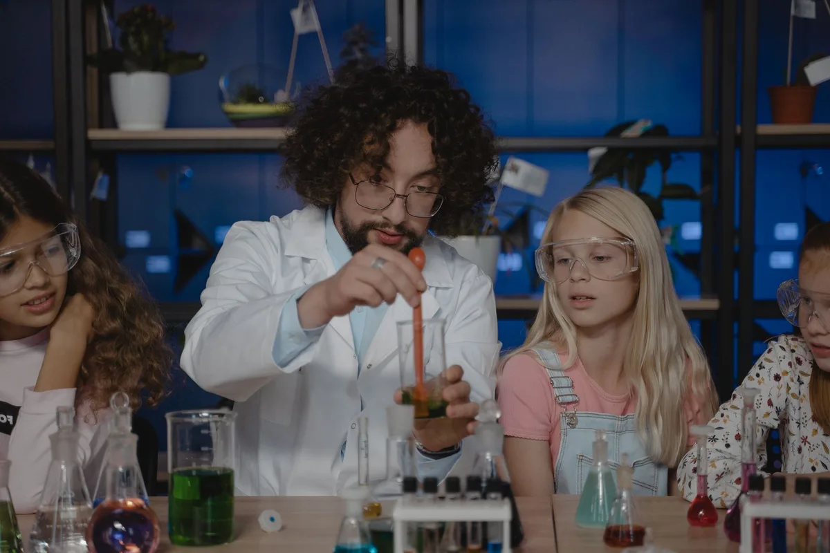 A teacher and students in a classroom, representing a school choosing a learning platform