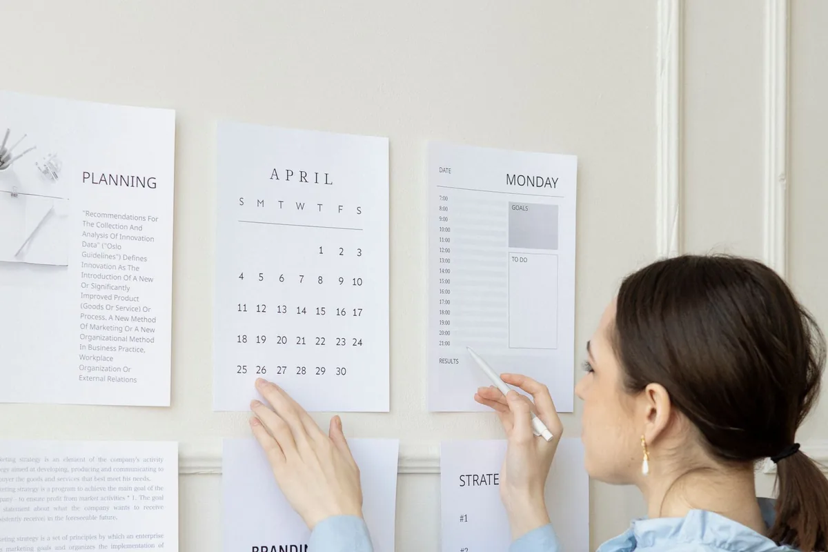 A project planning wall with a calendar and schedule for a website project